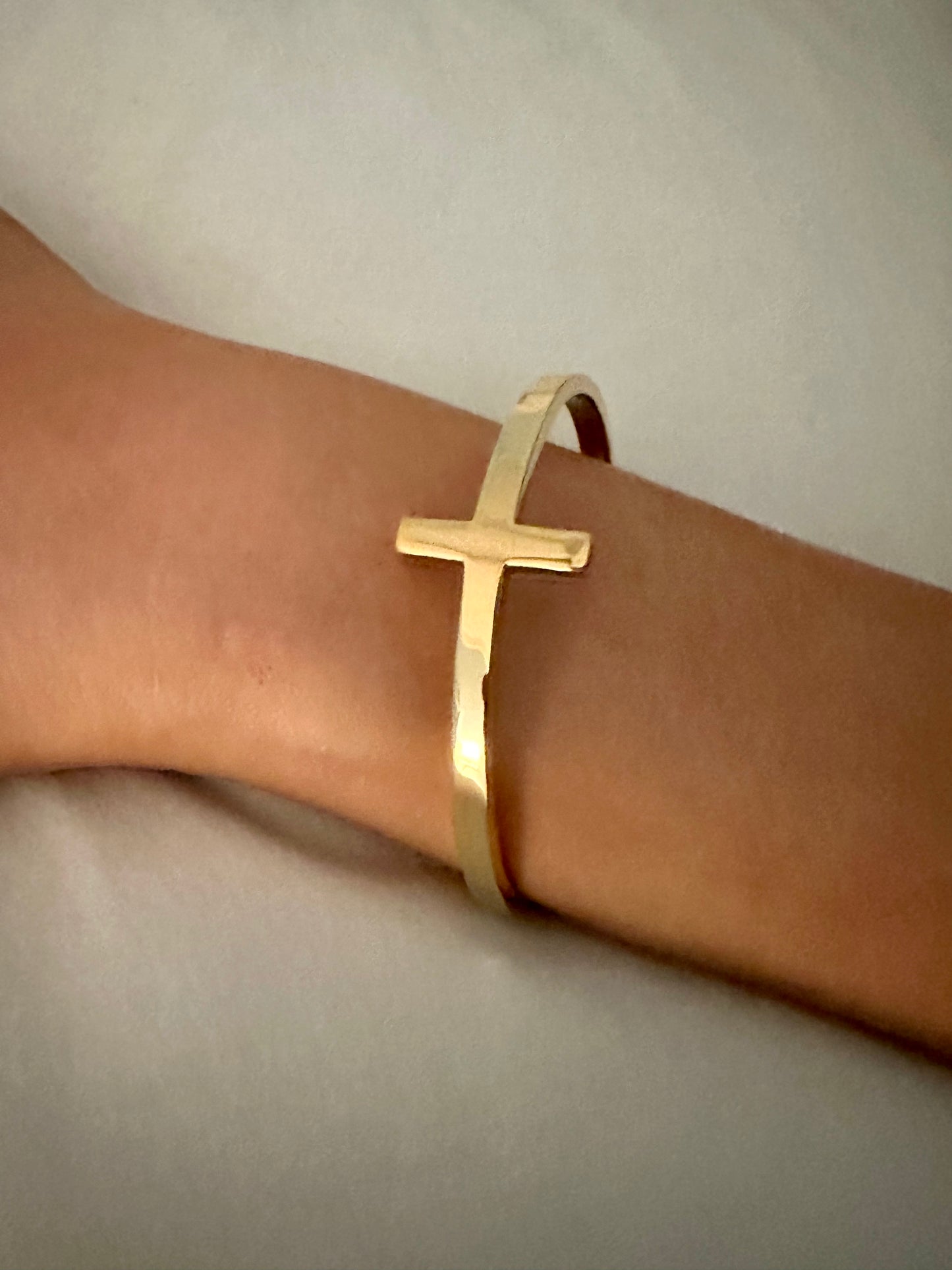 Haley Cross Bracelet - Our Haley Cross is Stainless Steel with 18K Overlay. C-shape open bangle for easy ware.