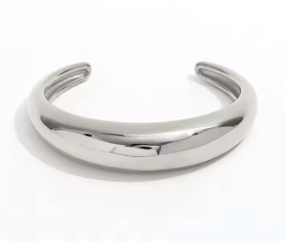 Luna - Our Luna adds a touch of ethereal charm to any outfit with its bold crescent moon shape. Elevate your jewelry collection by stacking her with your favorites or let her be the star of the show all on her own.