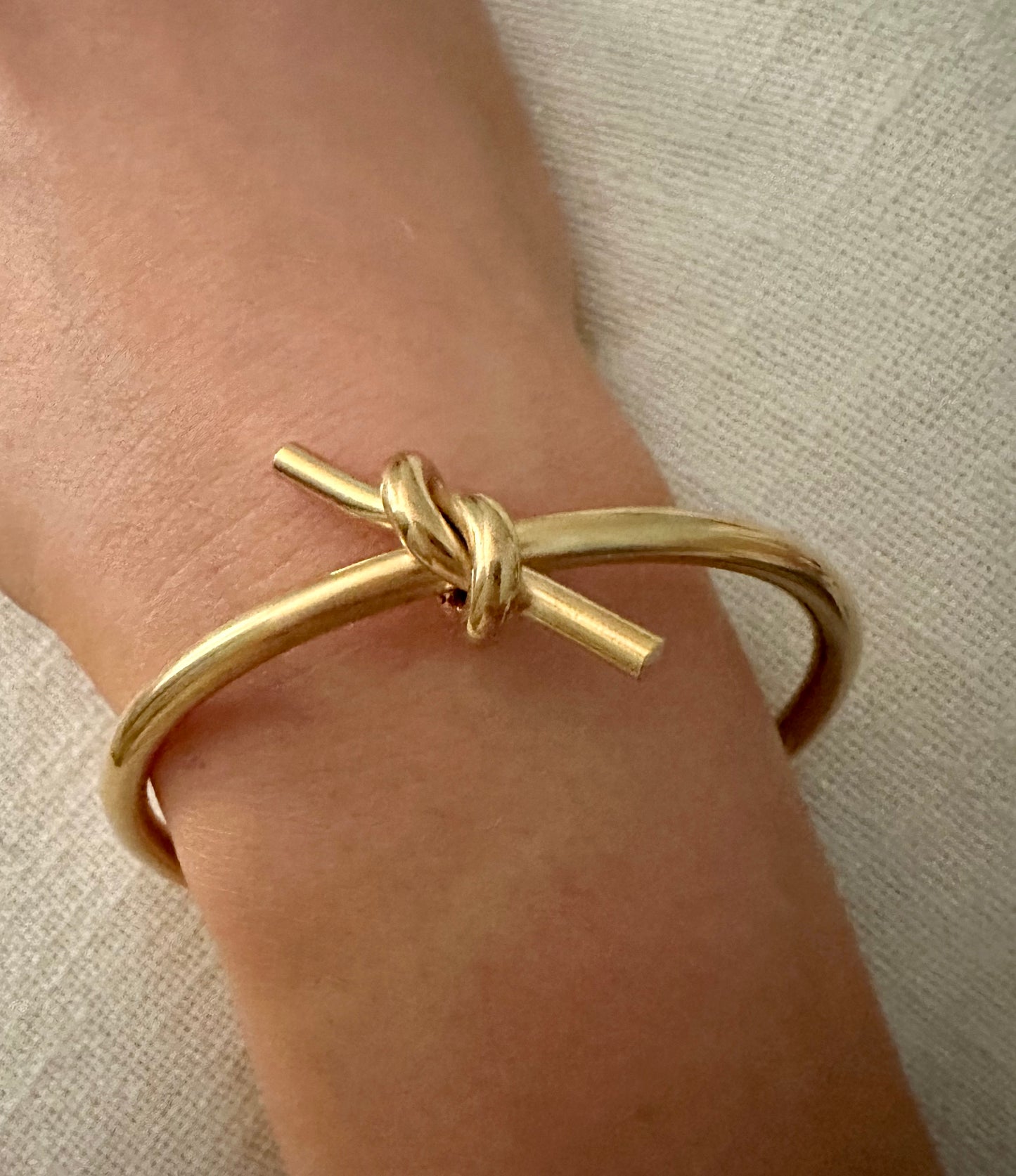 Scarlett Knot Bracelet- Our Scarlett Knot is Stainless Steel with 18K Overlay.  Scarlett has a little edge to her and pairs great with our Love Knot Bracelet. C-shaped opening for easy on and off.