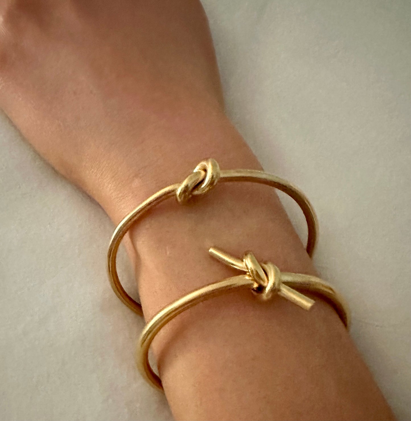 Scarlett Knot Bracelet- Our Scarlett Knot is Stainless Steel with 18K Overlay.  Scarlett has a little edge to her and pairs great with our Love Knot Bracelet. C-shaped opening for easy on and off.