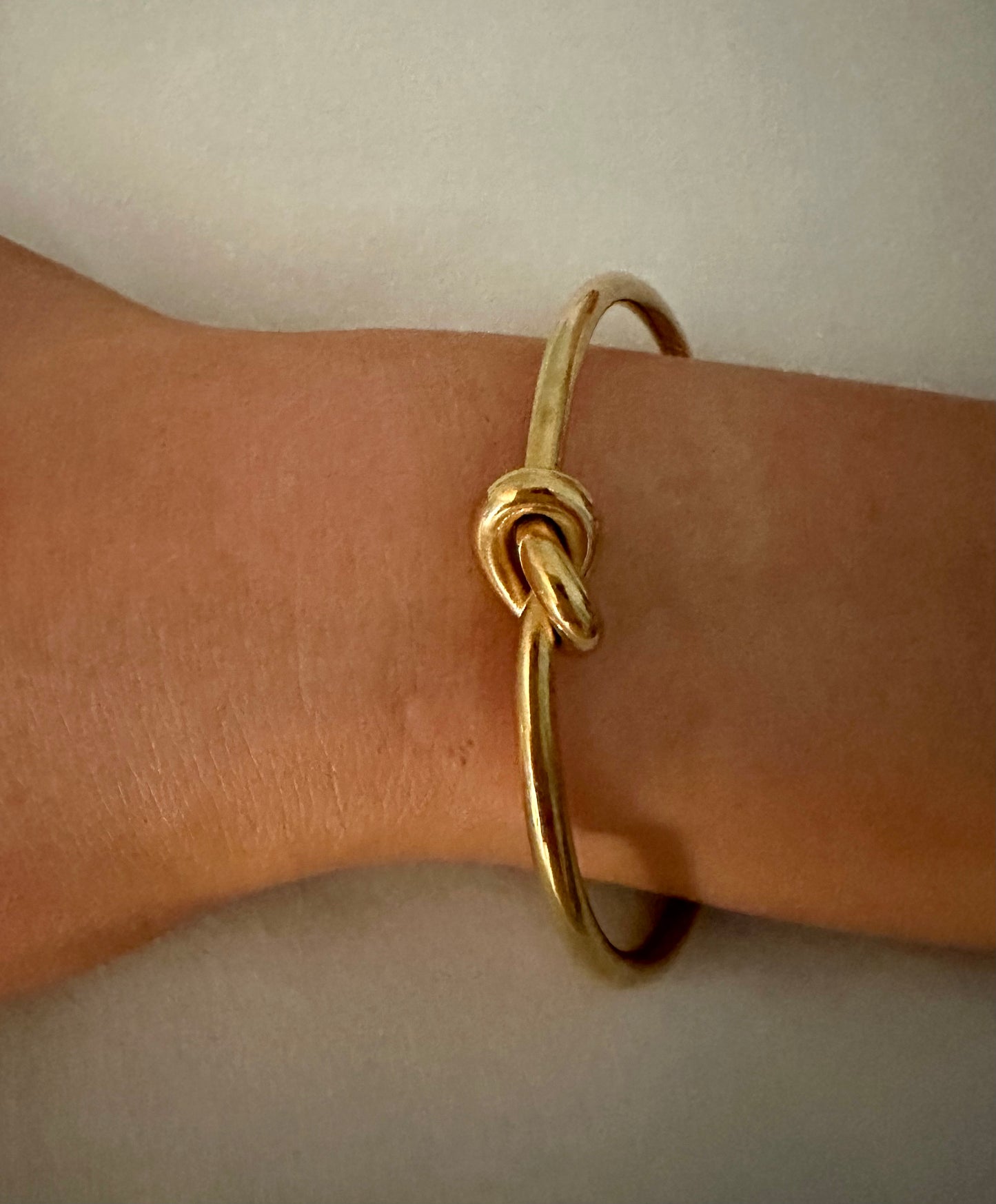 Love Knot Bracelet - Our Love Knot is Crafted Stainless Steel with 18K Gold Overlay Non-Tarnish C-shaped Opening.