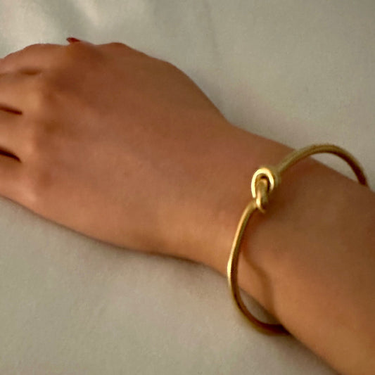 Love Knot Bracelet - Our Love Knot is Crafted Stainless Steel with 18K Gold Overlay Non-Tarnish C-shaped Opening.